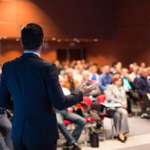 A man speaking at a business conference
