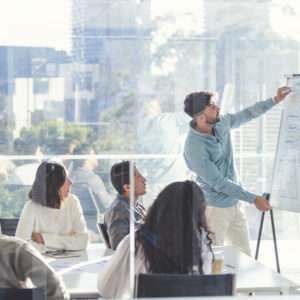 Business people watching a presentation on the whiteboard.