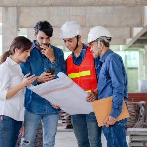 Construction and architectural team planning a new school building