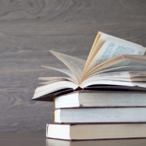 books on wooden deck tabletop
