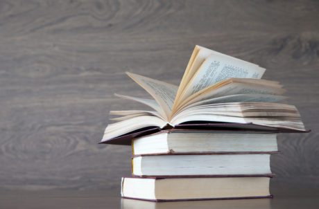 books on wooden deck tabletop
