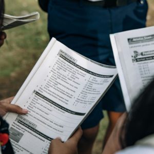 Students reviewing curriculum materials or taking an assessment, representing academic programs